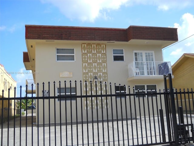 view of gate with a fenced front yard