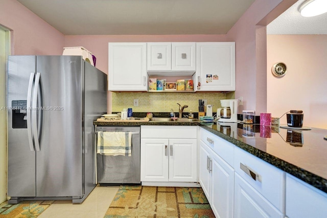 kitchen with open shelves, a sink, white cabinets, appliances with stainless steel finishes, and tasteful backsplash