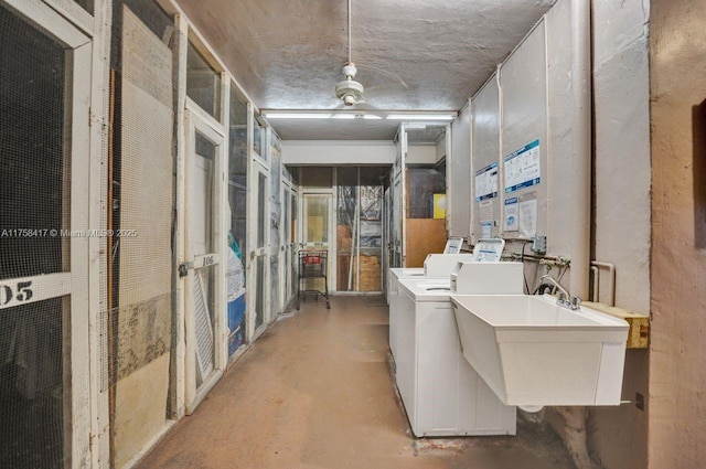 interior space featuring washer and clothes dryer and a sink