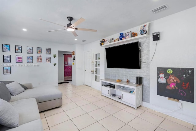 living area featuring light tile patterned floors, visible vents, ceiling fan, and recessed lighting