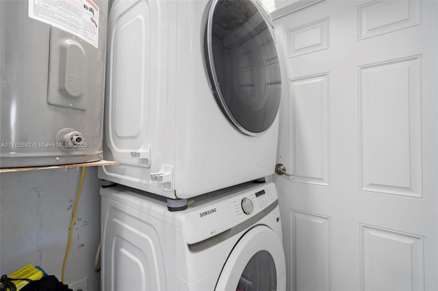 laundry area with laundry area and stacked washer and dryer