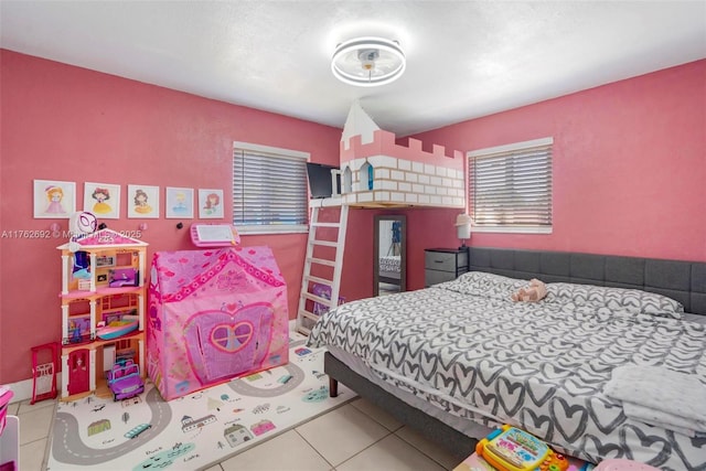 bedroom featuring tile patterned flooring