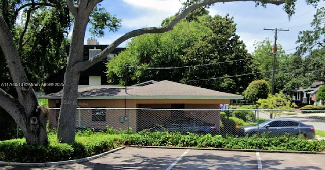 view of property featuring fence