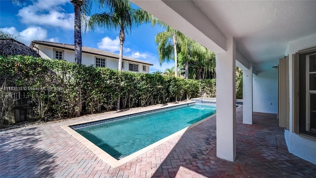 view of pool featuring a fenced in pool, a fenced backyard, and a patio area