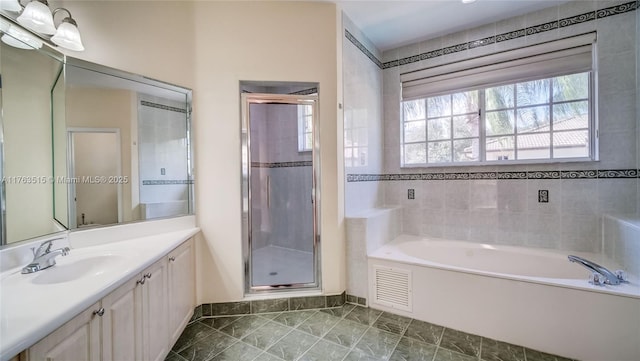 bathroom with vanity, visible vents, a shower stall, a bath, and marble finish floor