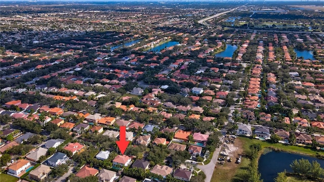 aerial view with a residential view and a water view