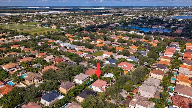 drone / aerial view with a residential view and a water view