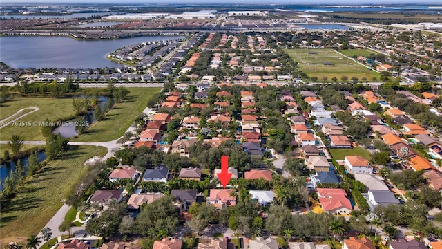 birds eye view of property with a residential view and a water view