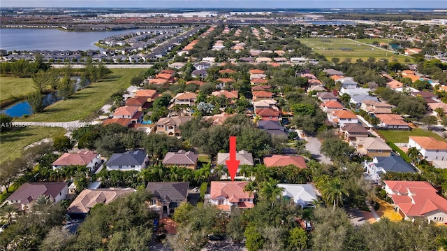 bird's eye view featuring a residential view and a water view