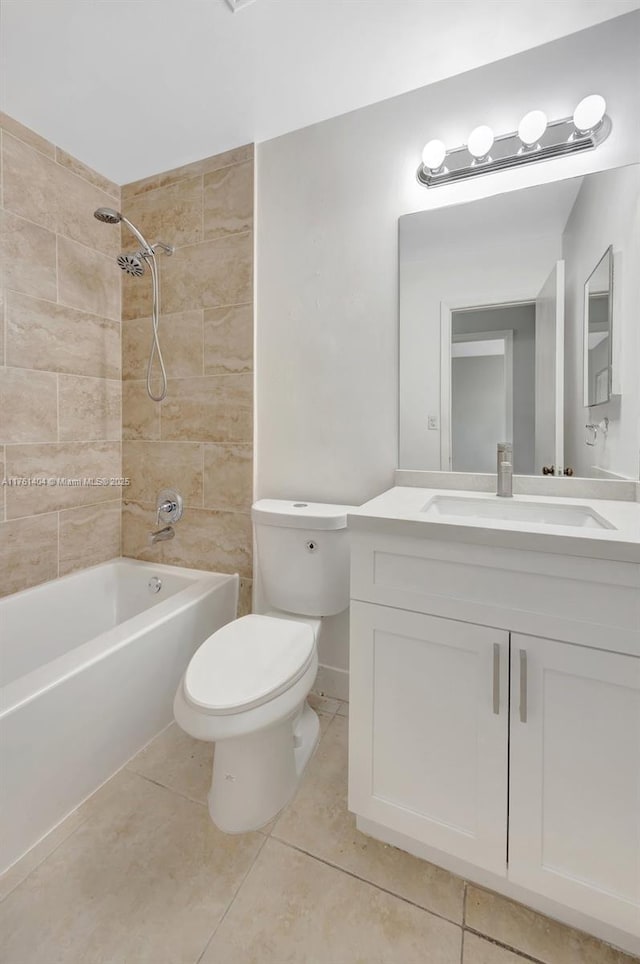 bathroom with tub / shower combination, toilet, vanity, and tile patterned flooring