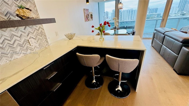 interior space with a city view and light wood-type flooring