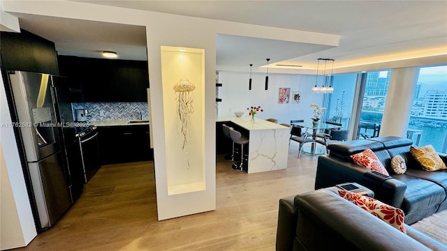 living room featuring light wood-style floors