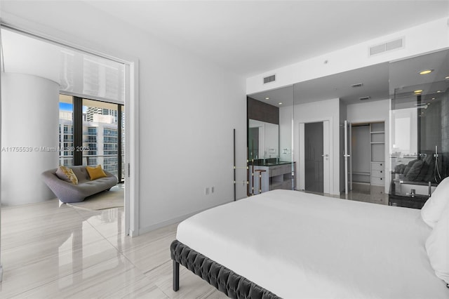 bedroom featuring visible vents and baseboards