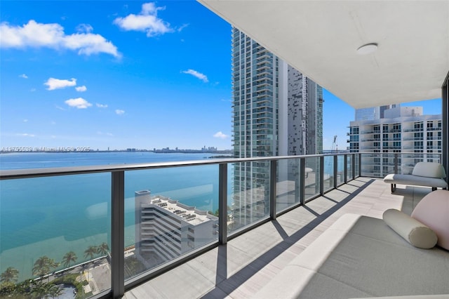 balcony featuring a water view