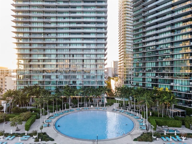 view of swimming pool with a city view