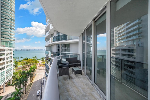 balcony featuring a water view