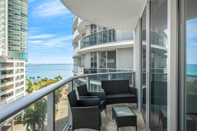 balcony featuring a water view