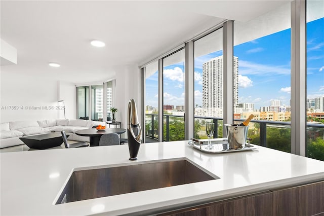 488 NE 18th St Unit 917, Miami, FL 33132 - kitchen with a city view, light countertops, open floor plan, and recessed lighting