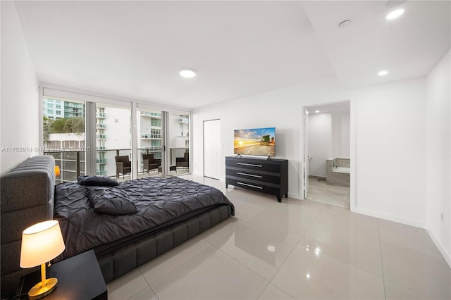 bedroom with light tile patterned flooring, recessed lighting, baseboards, and a closet