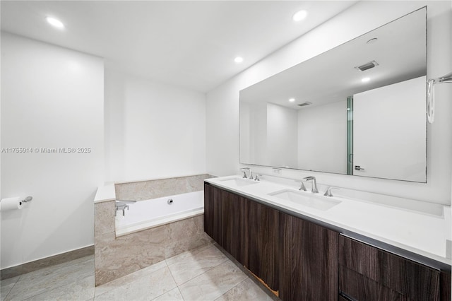 488 NE 18th St Unit 917, Miami, FL 33132 - full bathroom with double vanity, a garden tub, and recessed lighting