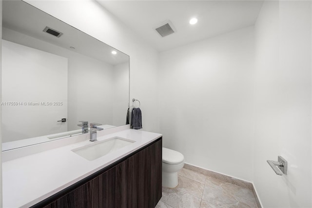 bathroom with visible vents, recessed lighting, toilet, and vanity