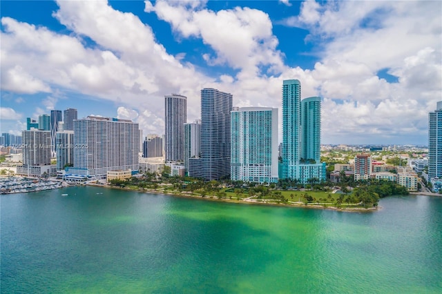 exterior space with a water view and a city view