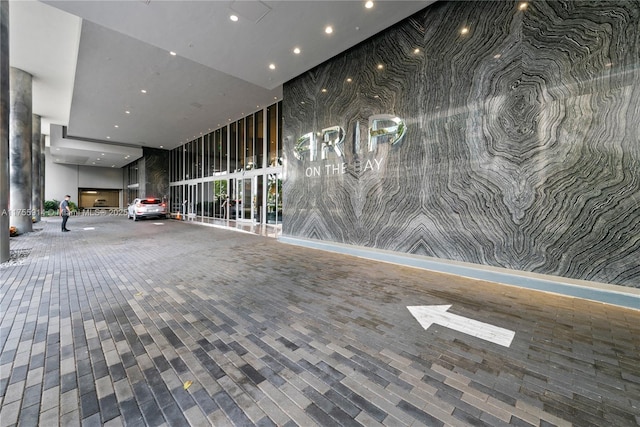 488 NE 18th St Unit 917, Miami, FL 33132 - building lobby with a wall of windows and recessed lighting