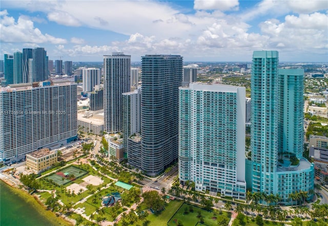 birds eye view of property featuring a city view and a water view