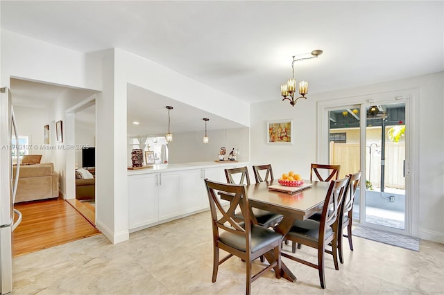 dining room with a chandelier