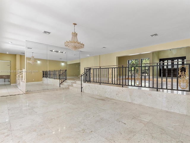 empty room featuring visible vents and baseboards