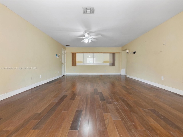 empty room with visible vents, baseboards, ceiling fan, and wood finished floors