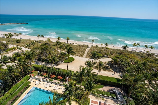 birds eye view of property with a view of the beach and a water view