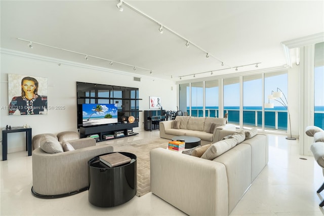 living room featuring track lighting and visible vents