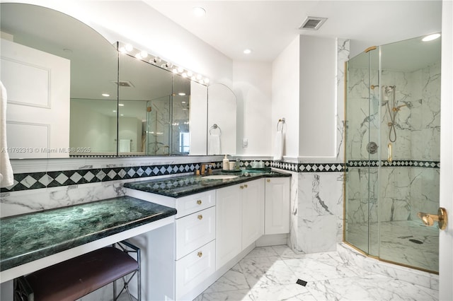 bathroom with a marble finish shower, marble finish floor, vanity, and visible vents