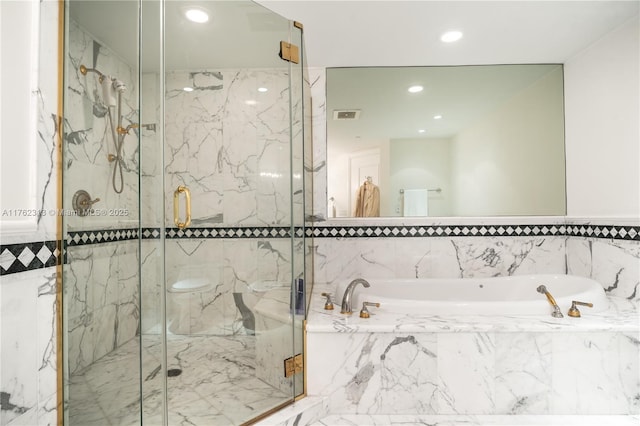 bathroom with a bath, visible vents, a marble finish shower, and recessed lighting