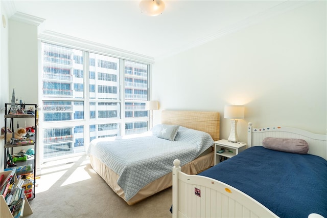 bedroom with expansive windows, ornamental molding, and carpet flooring