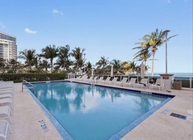 community pool with a patio area