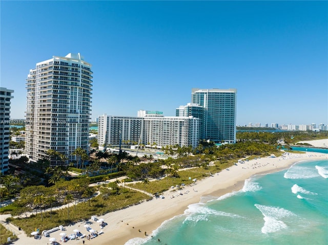 aerial view featuring a view of city, a water view, and a view of the beach