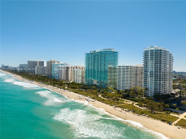 birds eye view of property with a city view, a view of the beach, and a water view