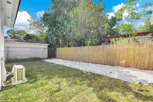 view of yard featuring ac unit and a fenced backyard