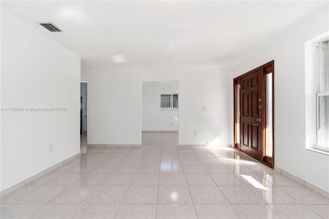 232 NW 58th Ct, Miami, FL 33126 - unfurnished room with light tile patterned floors, baseboards, and visible vents