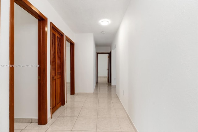 232 NW 58th Ct, Miami, FL 33126 - hallway with light tile patterned floors