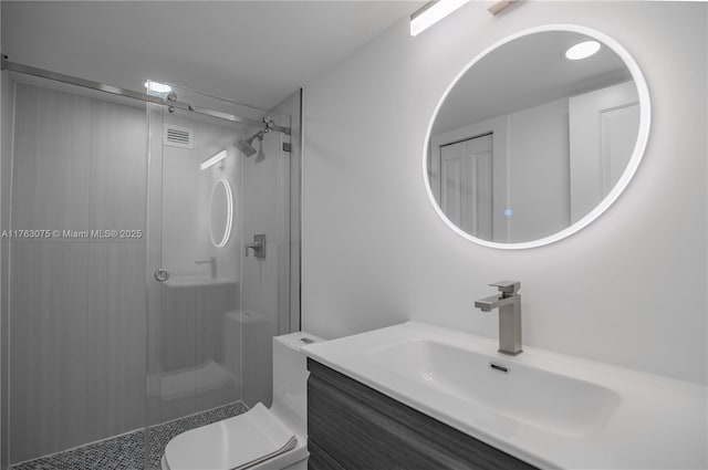 bathroom with vanity, a shower stall, toilet, and visible vents