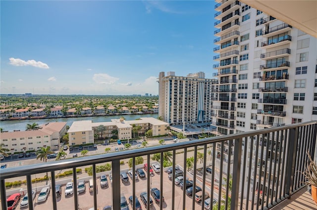 balcony with a view of city and a water view