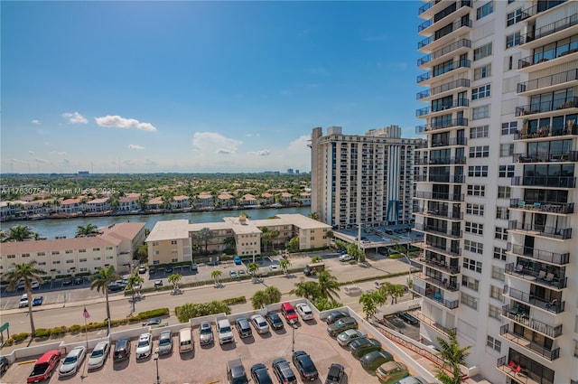 drone / aerial view featuring a view of city and a water view