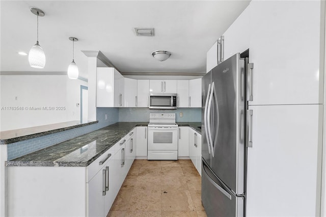 1541 SW 52nd Ave, Plantation, FL 33317 - kitchen featuring stainless steel appliances, decorative backsplash, white cabinets, and dark stone counters
