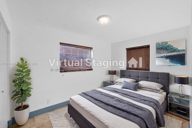 bedroom featuring baseboards