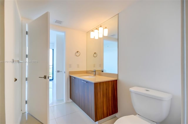 bathroom with visible vents, toilet, and vanity