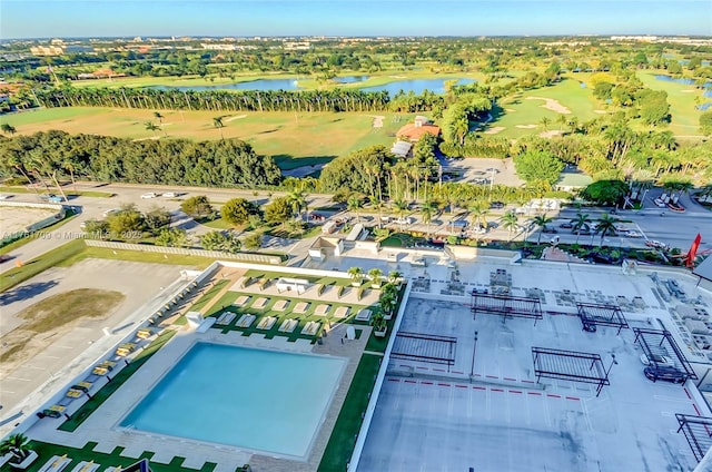 birds eye view of property featuring view of golf course and a water view