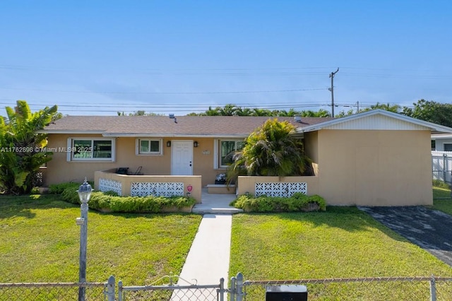 ranch-style house with a front yard, a porch, a fenced front yard, and stucco siding